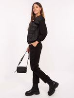 Black casual set with a detachable brooch.