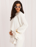 Ecru elegant blouse with lace trim.