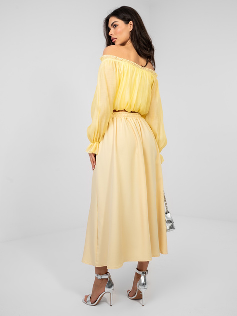 Pastelowa żółta spódnica z ozdobnym guzikiem