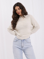 Light beige oversized women's sweater made of fluffy knit.
