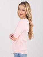 Light pink sweater made of soft knit.