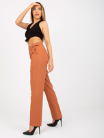 Hurt Miedziane damskie spodnie z materiału z kieszeniami